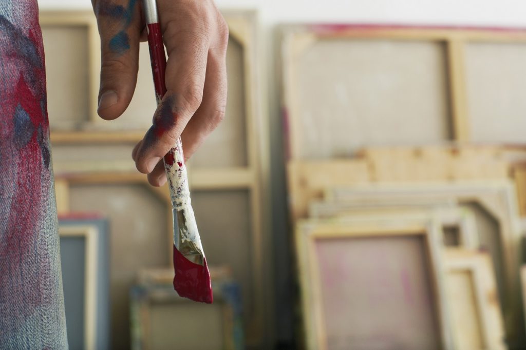 Artist holding a paintbrush
