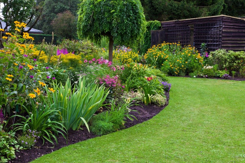 reen lawn in a colorful landscaped formal garden