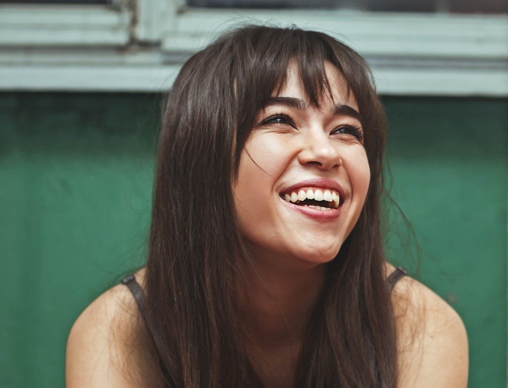 woman smiling and feeling happy