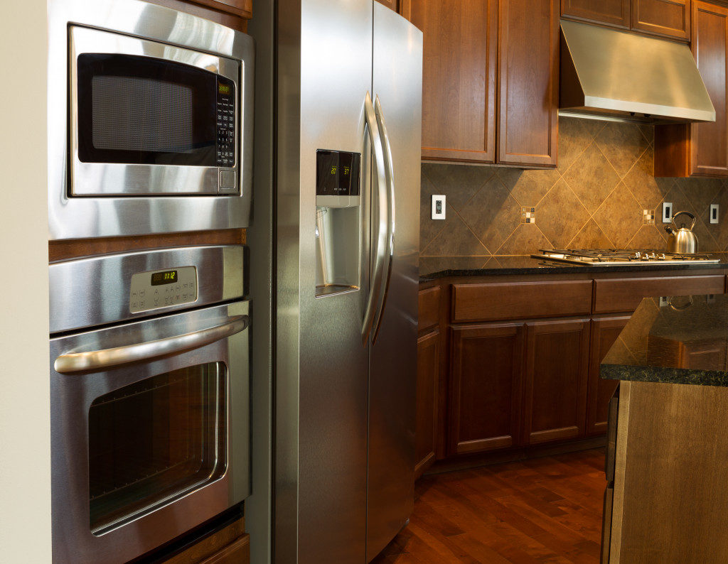Closeup photo of a stainless steel appliances in modern residential kitchen