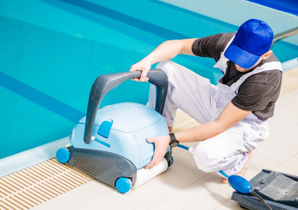 Man using a pool cleaner
