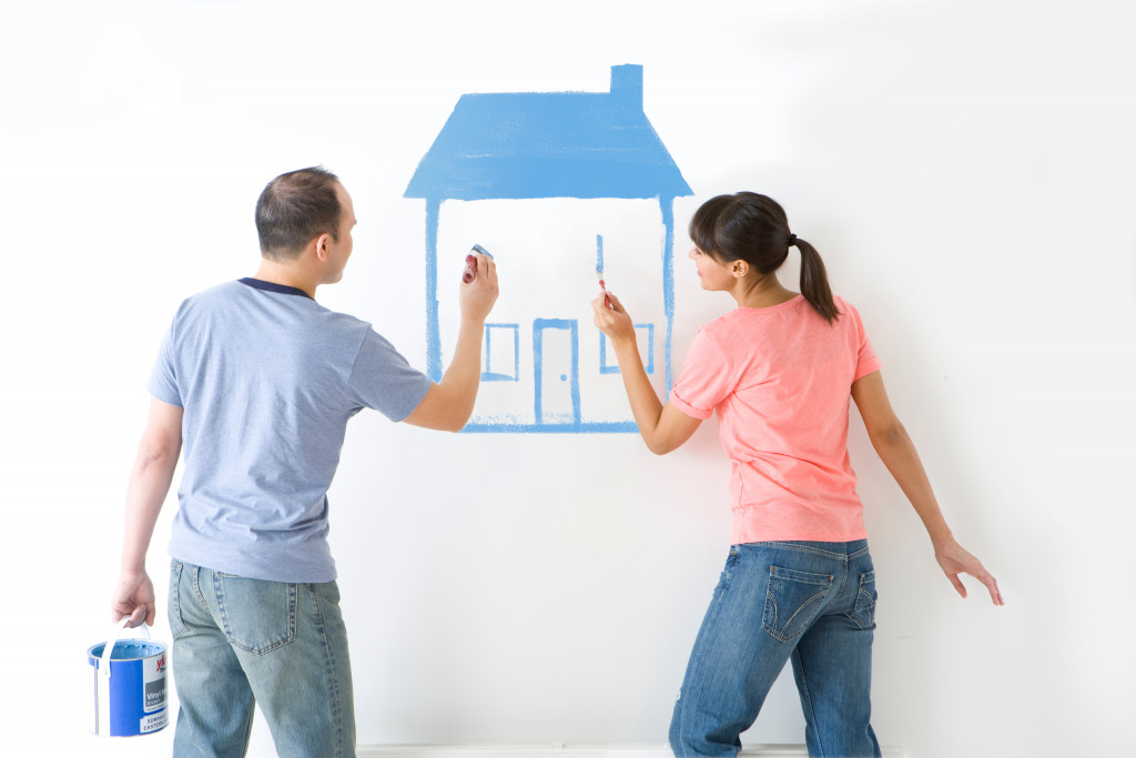 couple drawing a house