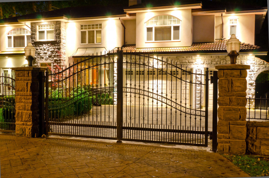 well-lit luxury house with gate