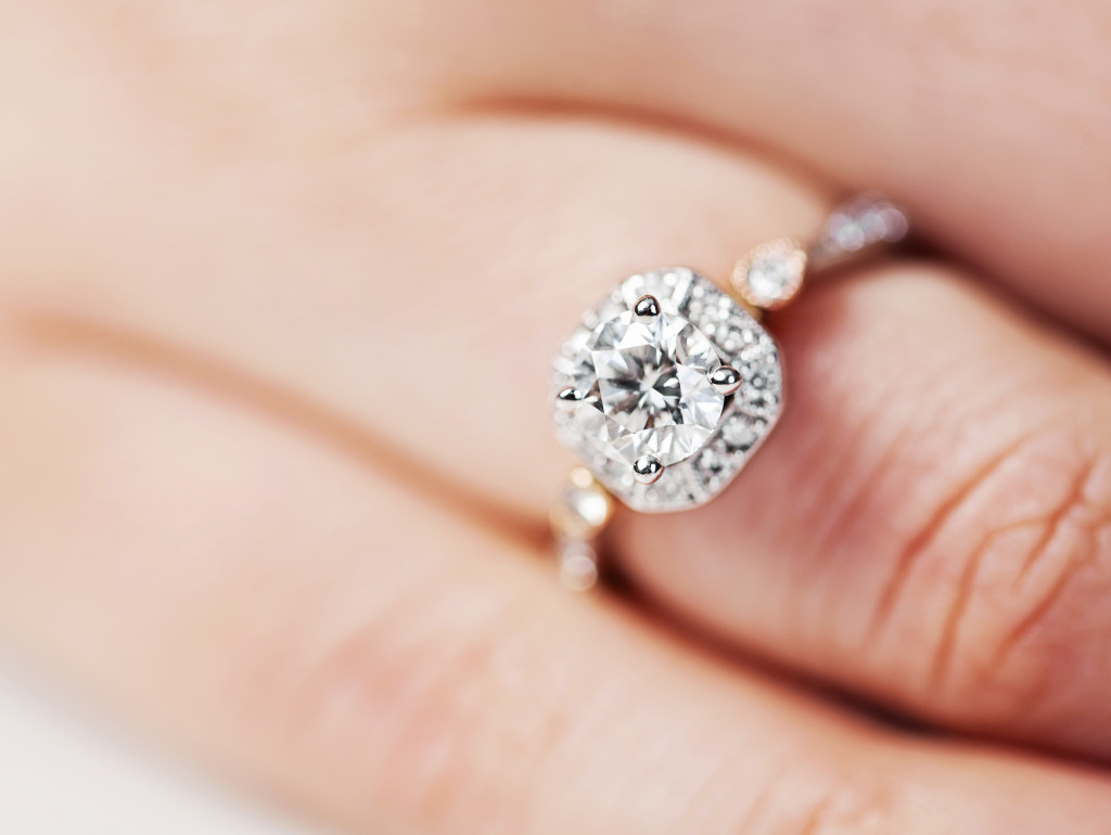 A woman wearing a stunning diamond ring