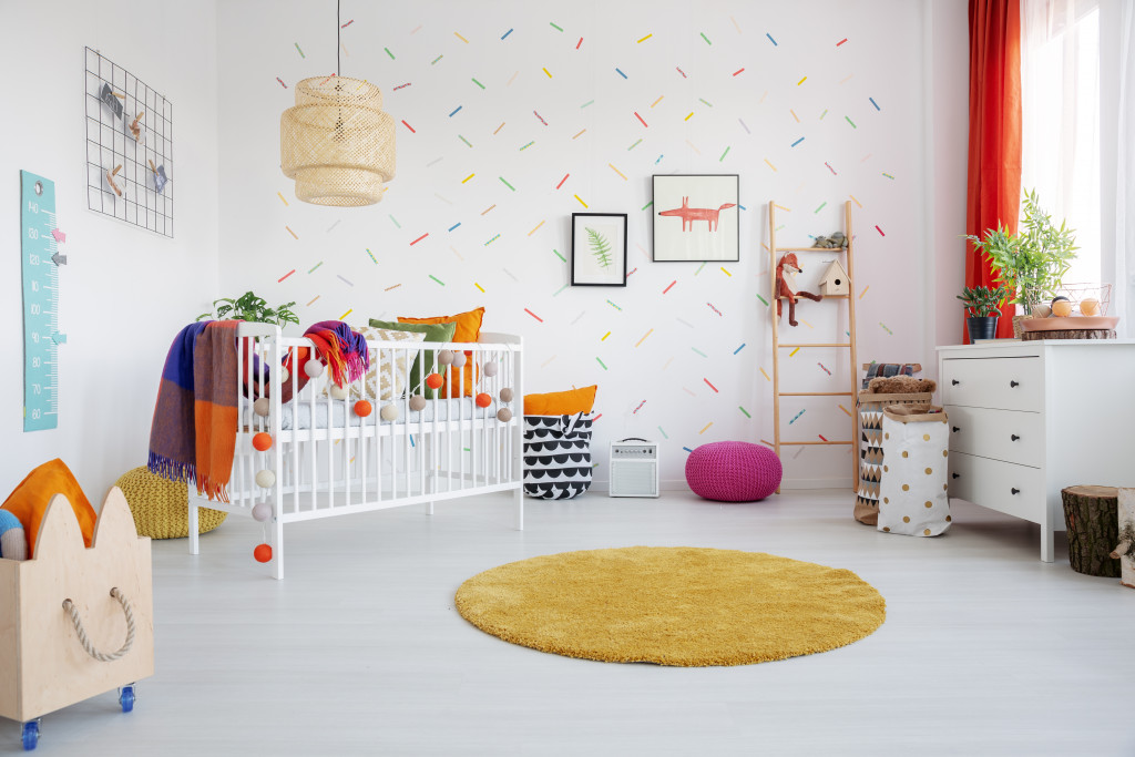 a crib and other storage solutions for a child's bedroom