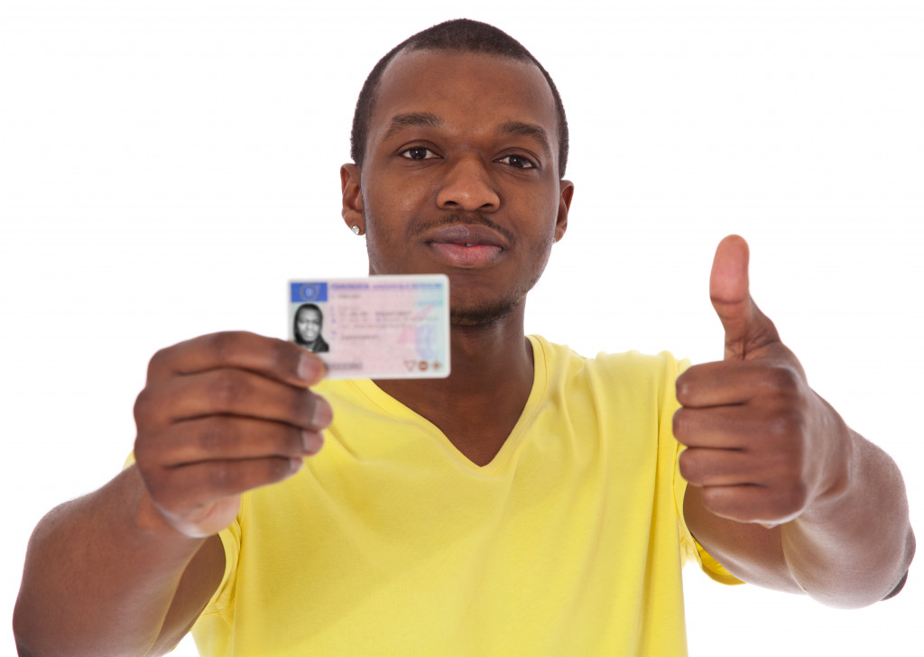 A man showing his driver's license
