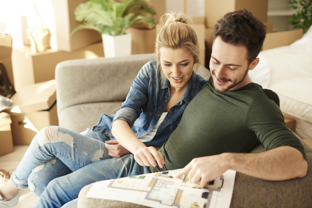 couple looking at house floor plan