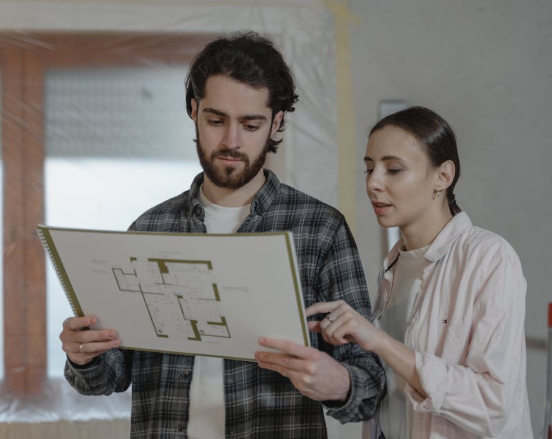 a couple checking their home improvement plan